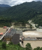 The backwaters of the Teesta Low III Dam project resulting in the demolition of a line of houses and shops upstream.