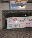 Climate activists protest dam lobbyists at Barcelona climate summit
