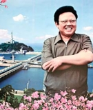 A poster of Kim Jong-il in front of a dam.