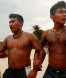 Members of the Munduruku indigenous tribe dance during a “Caravan of Resistance’” protest in São Luiz do Tapajós against plans to build a hydroelectric dam on 27 November 2014. 