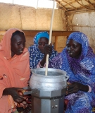 Women demonstrate an improved cook stove in a Darfur Refugee camp. (Darfur Stoves)