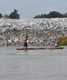 A fisherman in front of the Don Sahong cofferdam
