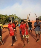 Brazil dam row – local activists march past machinery being used in the construction of the massive Belo Monte hydroelectric dam.