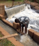 Opening the sluice gate on a small hydro project.