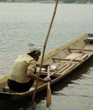 Khmu Elder Rowing Boat Along the Nam Ou