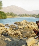 A Himba man at the Kunene River, upstream of the Epupa dam site.