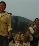 Lao villagers walking on the Mekong River bed during the 2010 drought