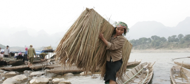 Villagers from Chiang Yen village move their houses piece by piece to make way for the Son La Dam.