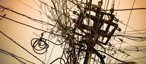 India’s grid system is in poor repair, as symbolized by this ad-hoc collection of connections in Raipur, India