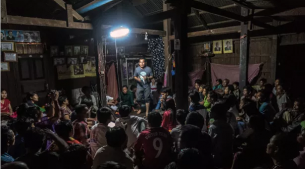 Yun Lorang, secretary-coordinator of the Cambodia Indigenous Peoples Alliance, holds a meeting with residents and visitors in Kbal Romeas village.