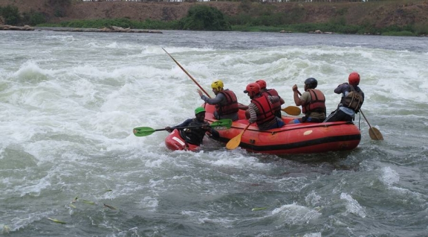 River guides help tourists rafting the intense rapids on the White Nile. Many are worried they will lose their jobs if a planned hydroelectric dam floods the rapids near Uganda's Kalagala Falls.