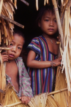 Young children in a house on the Nakai Plateau, which will be inundated by the proposed Nam Theun 2 Dam. Bolikhamxai and Khammouane Provinces, Laos, 2009.