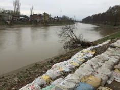 The flood waters of the river Jhelum breached embankments at various points in September 2014