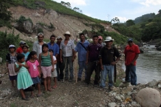 Tomás with his community next to the Gualcarque River