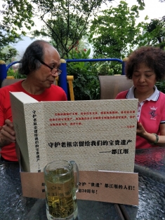 Former Dujiangyan City Political Consultative Committee Chairman Peng Wei, left, and his wife Tang Jianhua, a trained hydrologist, worked for six years to protect Dujiangyan from the Shengxing power station.  This book is entitled “Protect the Precious Heritage Our Ancestors Left Behind: Dujiangyan”. 