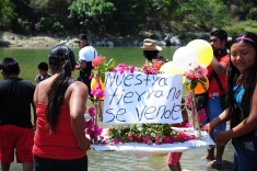 Communities fighting La Parota Dam on the River Papagayo float hand-made boats down the river as part of the International Day of Action for Rivers