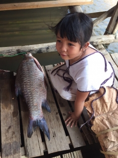 Girl with a fish on the Salween River.