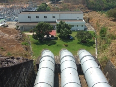View from the crest of the dam to the powerplant housing three 12 MW turbines. Water is released into the Lam Dom Yai River (a tributary of the Mun River).