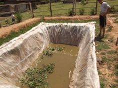 This fish pond, given to villagers affected by the Nam Song Dam, is not nearly large enough to compensate for lost fisheries from the Nam Song River.