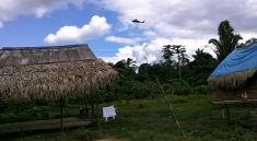 A military helicopter circles over the Sawre Muybu village on 26th March 2013