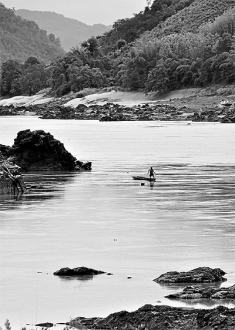 A fisherman near the site of the proposed Xayaburi dam in Paksey, northern Laos. The hydropowered dam will cause damage to local fisheries downstream of the Mekong River and adversely affect large numbers of people. 