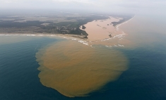 An aerial view of the Rio Doce at an area where the river joins the sea, on the coast of Espírito Santo in Regência village. 