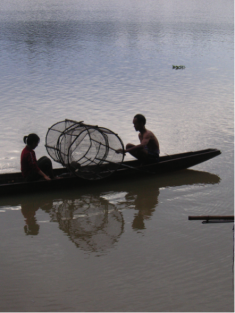 Fisherfolk on the Mekong at dawn. 