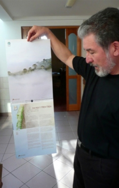 Bernardo Reyes holding a calendar he helped produce abour conservation in the Nahuelbuta mountains of Cental Chile.