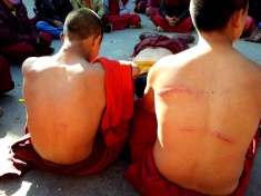 Monks beaten up by batons for protesting against dams in Tawang