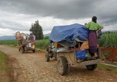 A Kachin refugee family flees the fighting at the Dapein dams in June 2011. Dapein I Dam is trying to seeking carbon credits.