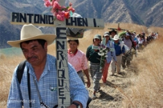 Carlos Chen Osorio leads a procession to remember victims of the Chixoy Dam massacres.