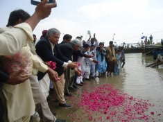 Pakistan Fisherfolk Forum toss roses into the Indus River as part of their two-week-long celebration for the International Day of Action for Rivers 2015.