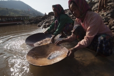 Women pan for gold near the Xayaburi Dam site in Laos.
