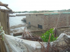 A submerged house between the river and the Sehrish Nagar protective embankment